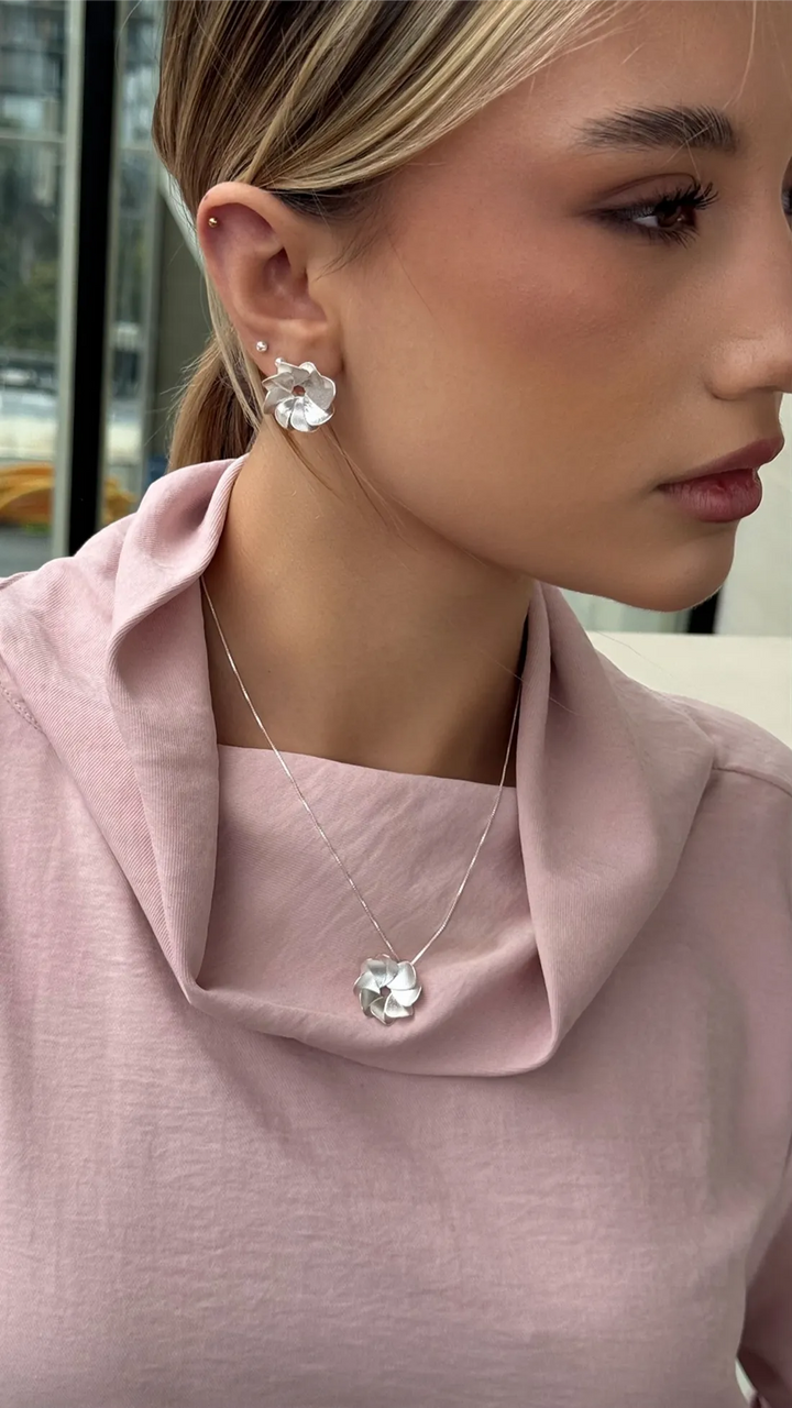 MARCELA RODRIGUEZ TOPO POMPONERO DORADO Y O PLATA